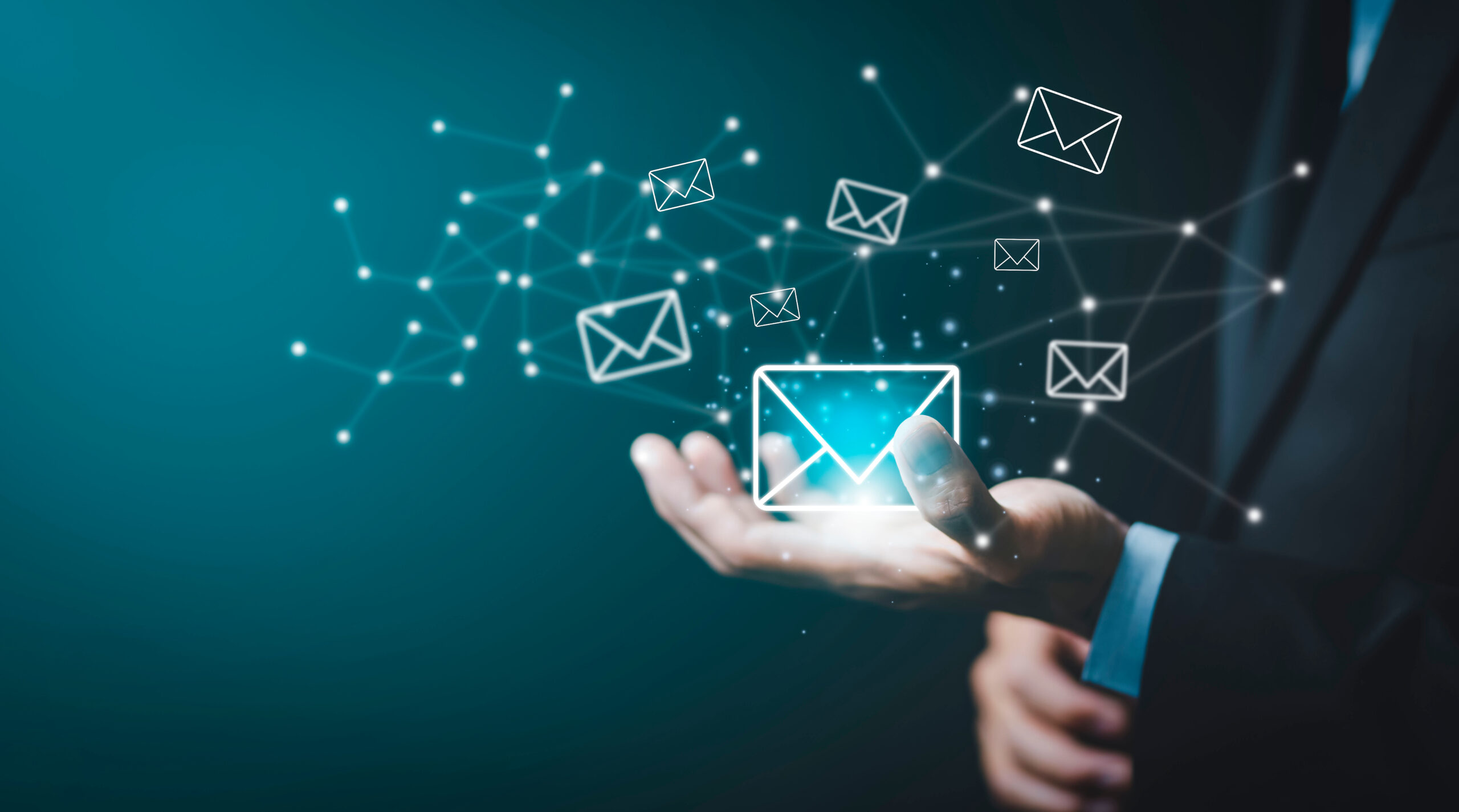 Businessman hand holding e-mail icon letter on a touch screen interface, virtual postal envelope, concept of spam email, internet and networking, Contact us newsletter email and protect your personal.